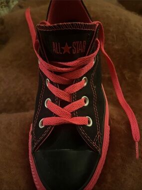 Converse women’s Black High-Top Sneakers with Bright Pink Accents